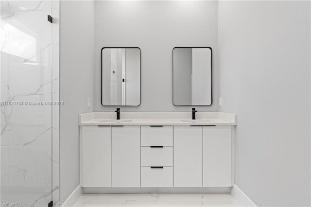 1003 Casino Ave, Lehigh Acres, FL 33971 - bathroom with a marble finish shower, double vanity, and marble look tiles