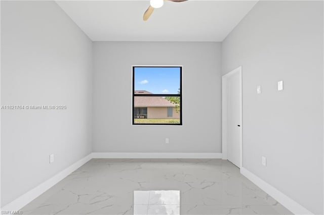 1003 Casino Ave, Lehigh Acres, FL 33971 - unfurnished room featuring light marble finish flooring and a ceiling fan