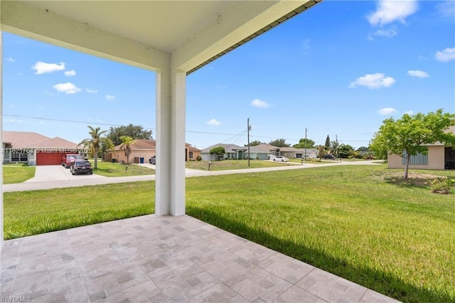 1003 Casino Ave, Lehigh Acres, FL 33971 - view of patio featuring a residential view