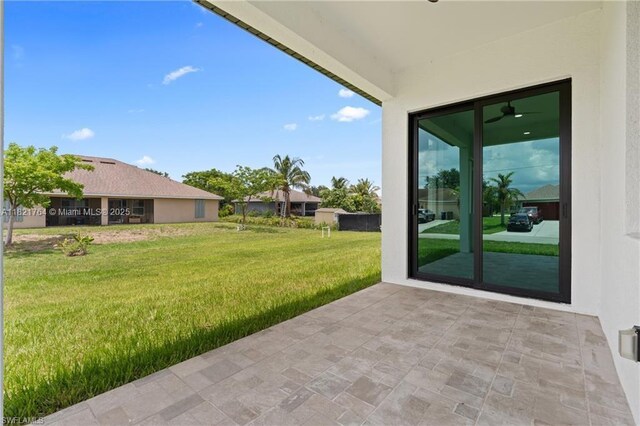 1003 Casino Ave, Lehigh Acres, FL 33971 - view of grassy yard with a patio