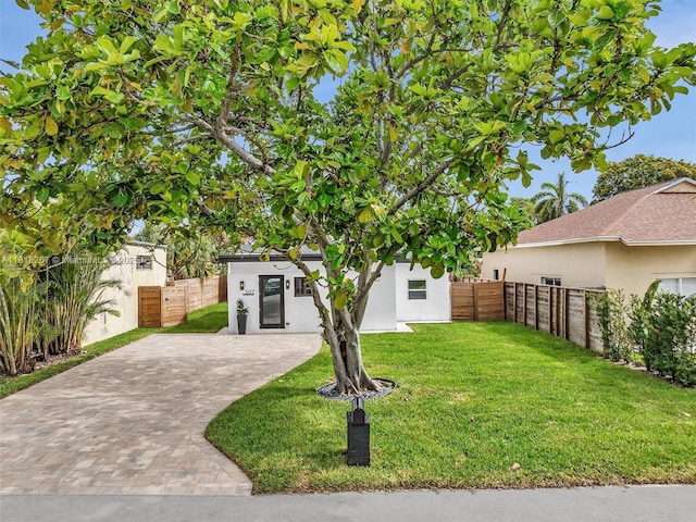 107 Central Ave, Delray Beach, FL 33483 - view of front of house with stucco siding and driveway