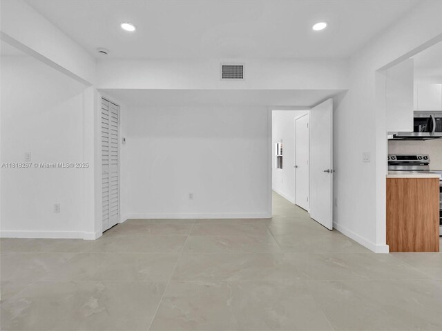 107 Central Ave, Delray Beach, FL 33483 - empty room with recessed lighting and light tile patterned floors
