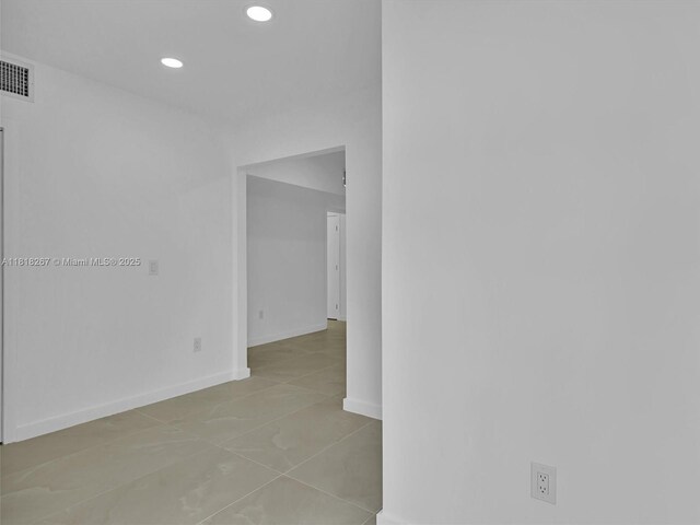 107 Central Ave, Delray Beach, FL 33483 - tiled empty room featuring recessed lighting and baseboards