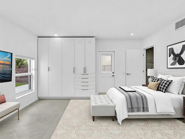 107 Central Ave, Delray Beach, FL 33483 - bedroom with recessed lighting and concrete flooring
