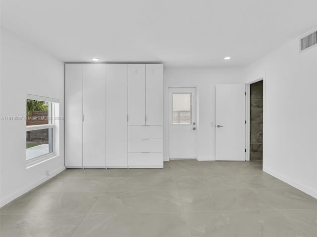107 Central Ave, Delray Beach, FL 33483 - unfurnished bedroom featuring baseboards and recessed lighting