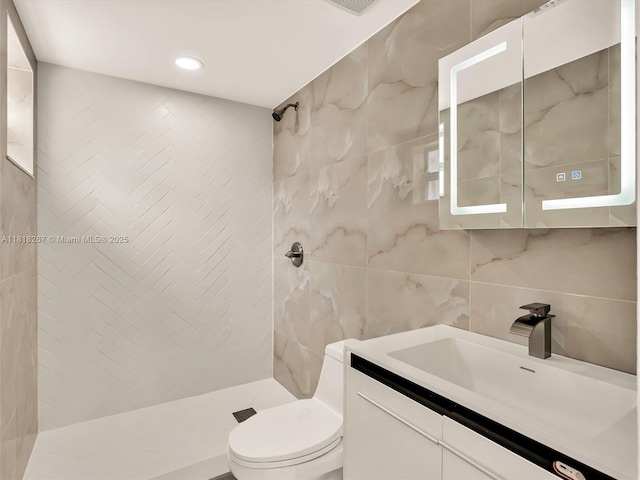 107 Central Ave, Delray Beach, FL 33483 - bathroom with tile walls, a tile shower, vanity, and recessed lighting