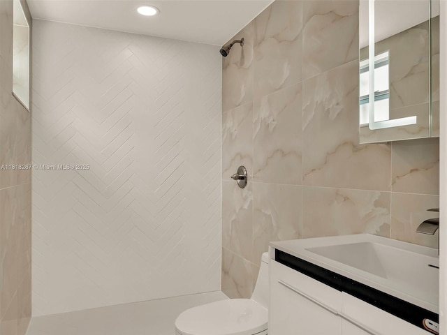 107 Central Ave, Delray Beach, FL 33483 - bathroom with tile walls, vanity, a tile shower, and recessed lighting