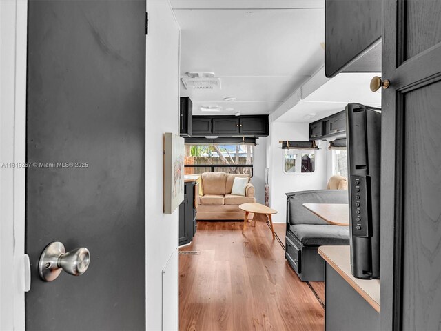 107 Central Ave, Delray Beach, FL 33483 - hall featuring light wood finished floors