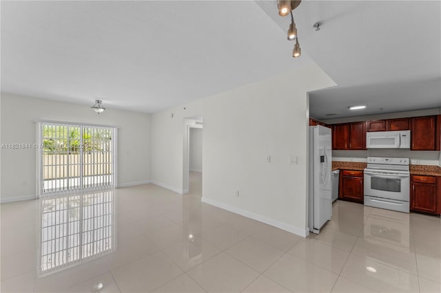 5271 SW 8th St Unit 213, Miami, FL 33134 - unfurnished living room with light tile patterned floors and baseboards