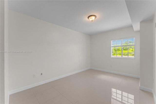 5271 SW 8th St Unit 213, Miami, FL 33134 - empty room featuring baseboards and light tile patterned floors