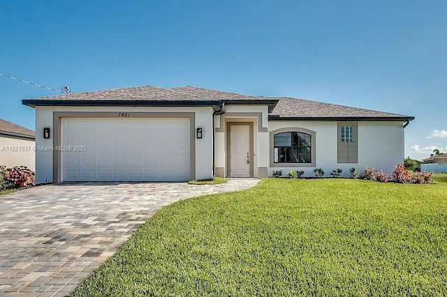 3024 NW 6th Pl, Cape Coral, FL 33993 - view of front of property featuring a front yard, stucco siding, decorative driveway, a garage, and roof with shingles