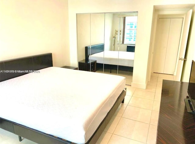 1965 S Ocean Dr Unit 5B, Hallandale Beach, FL 33009 - bedroom featuring light tile patterned floors and a closet