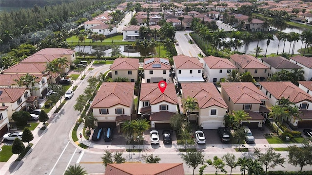 8885 NW 100th Pl, Doral, FL 33178 - aerial perspective of suburban area featuring a large body of water