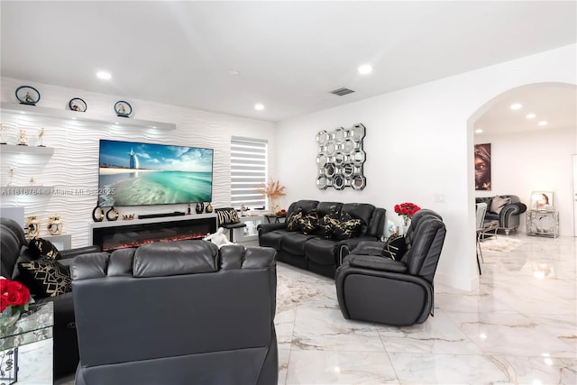 8885 NW 100th Pl, Doral, FL 33178 - living room featuring arched walkways, light marble finish flooring, and recessed lighting