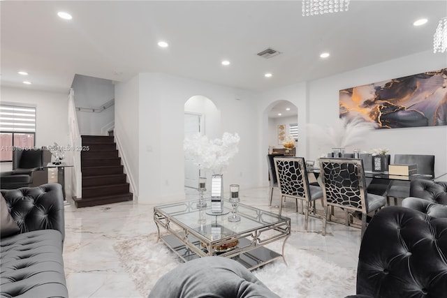 8885 NW 100th Pl, Doral, FL 33178 - living room featuring arched walkways, marble tiled floors, recessed lighting, and stairway