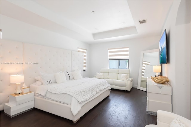 8885 NW 100th Pl, Doral, FL 33178 - bedroom with a raised ceiling and dark wood-type flooring