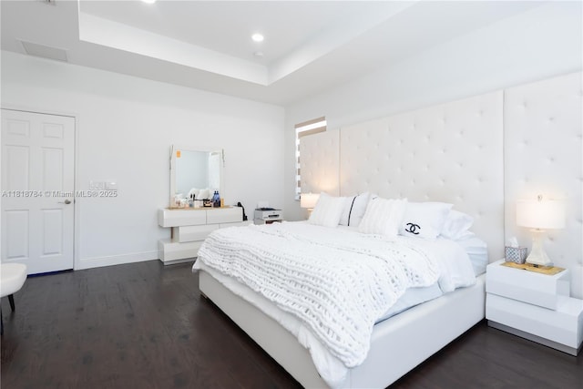 8885 NW 100th Pl, Doral, FL 33178 - bedroom with dark wood-style flooring, a raised ceiling, and recessed lighting