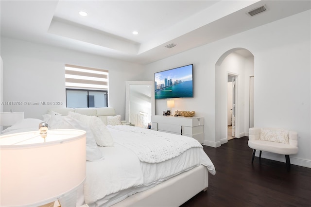 8885 NW 100th Pl, Doral, FL 33178 - bedroom with arched walkways, dark wood-style flooring, a raised ceiling, and recessed lighting