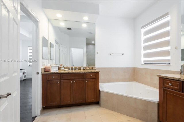 8885 NW 100th Pl, Doral, FL 33178 - bathroom with vanity, a garden tub, recessed lighting, a tile shower, and tile patterned flooring