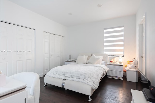 8885 NW 100th Pl, Doral, FL 33178 - bedroom with multiple closets and dark wood-style flooring