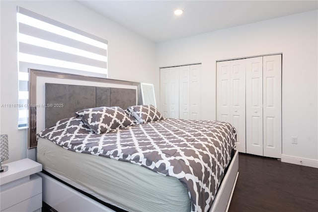 8885 NW 100th Pl, Doral, FL 33178 - bedroom featuring two closets, recessed lighting, and dark wood-type flooring