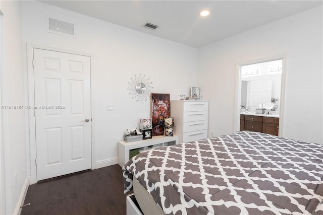 8885 NW 100th Pl, Doral, FL 33178 - bedroom with dark wood-style floors, recessed lighting, and connected bathroom