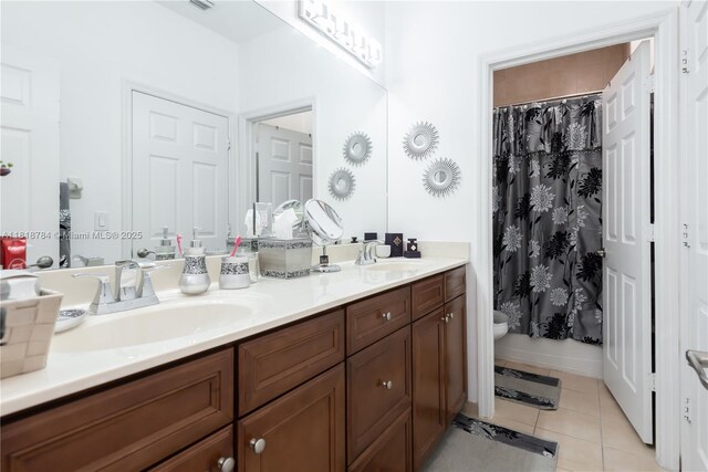 8885 NW 100th Pl, Doral, FL 33178 - bathroom with double vanity, tile patterned flooring, and a shower with curtain