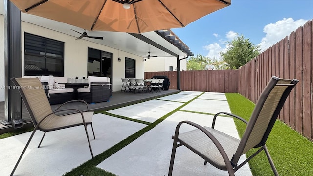 8885 NW 100th Pl, Doral, FL 33178 - fenced backyard with outdoor dining space, a patio, and a ceiling fan