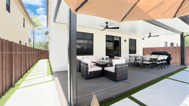 8885 NW 100th Pl, Doral, FL 33178 - deck with outdoor dining area and a ceiling fan