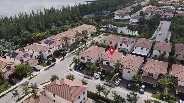 8885 NW 100th Pl, Doral, FL 33178 - aerial view of residential area featuring a heavily wooded area
