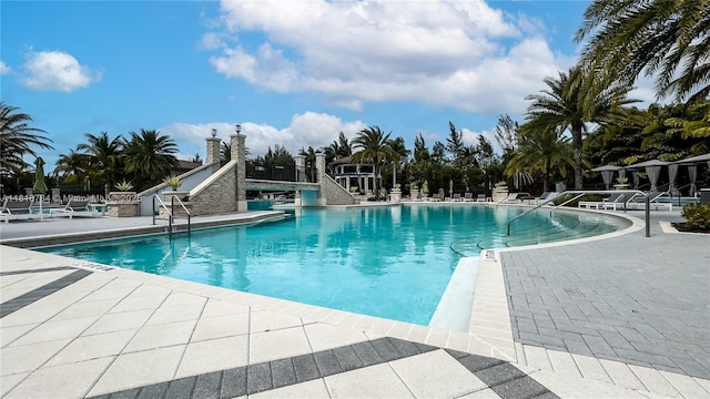 8885 NW 100th Pl, Doral, FL 33178 - community pool with a patio area