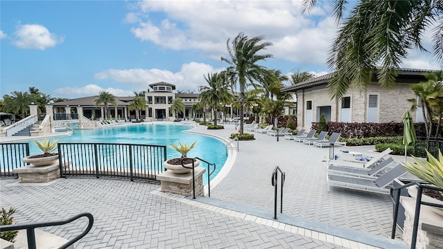 8885 NW 100th Pl, Doral, FL 33178 - community pool featuring a patio