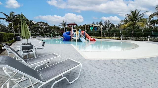 8885 NW 100th Pl, Doral, FL 33178 - community pool featuring a water slide and a patio area