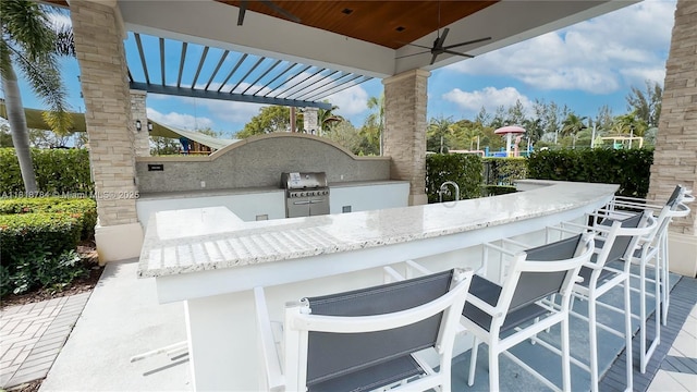 8885 NW 100th Pl, Doral, FL 33178 - view of patio / terrace with exterior kitchen