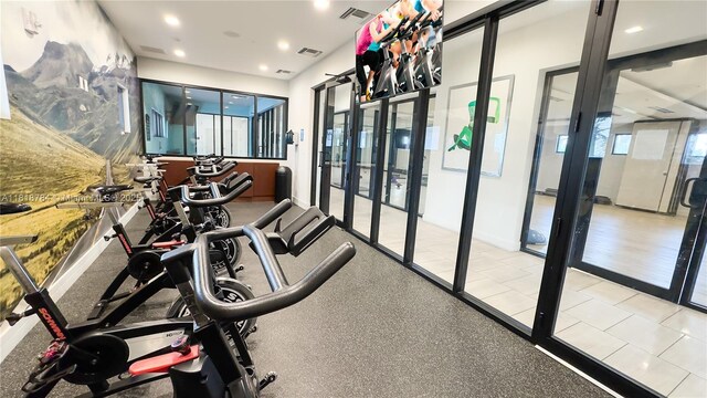 8885 NW 100th Pl, Doral, FL 33178 - gym featuring plenty of natural light and recessed lighting