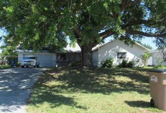 1029 NE Van Loon Ln, Cape Coral, FL 33909 - view of front facade with driveway and a front yard
