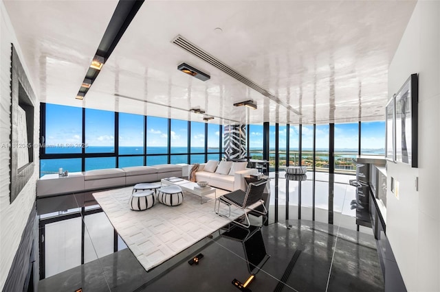 100 S Pointe Dr Unit 3003, Miami Beach, FL 33139 - living area featuring a water view and a wall of windows