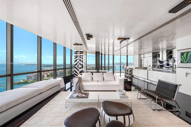 100 S Pointe Dr Unit 3003, Miami Beach, FL 33139 - living room featuring a water view and floor to ceiling windows
