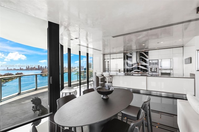 100 S Pointe Dr Unit 3003, Miami Beach, FL 33139 - dining area featuring floor to ceiling windows and a water view