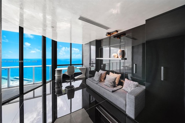 100 S Pointe Dr Unit 3003, Miami Beach, FL 33139 - living area featuring a water view, tile patterned floors, and a wall of windows
