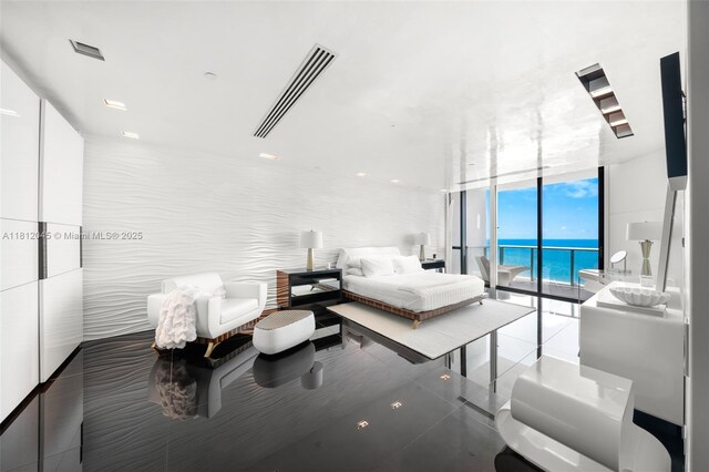 100 S Pointe Dr Unit 3003, Miami Beach, FL 33139 - bedroom featuring a wall of windows, access to exterior, a water view, and tile patterned floors