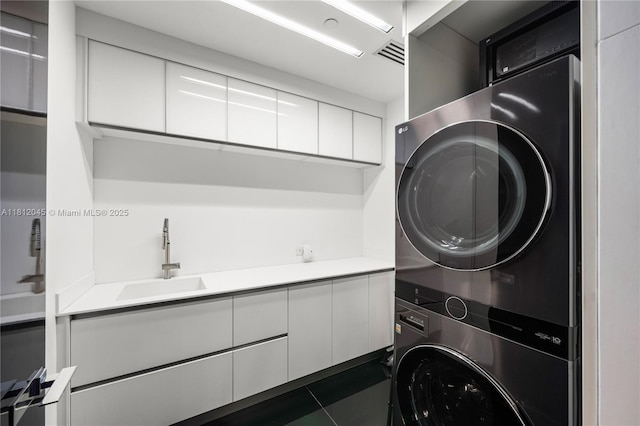 100 S Pointe Dr Unit 3003, Miami Beach, FL 33139 - laundry area with stacked washer / dryer and a sink