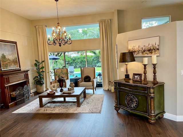 4370 NW 62nd Ter, Coral Springs, FL 33067 - living room featuring a chandelier, healthy amount of natural light, and wood finished floors