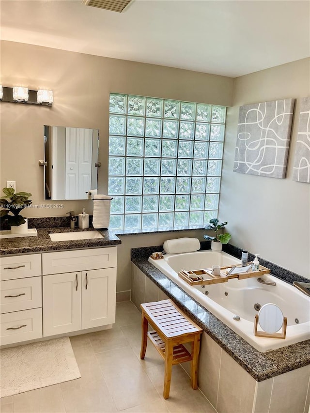 4370 NW 62nd Ter, Coral Springs, FL 33067 - full bath featuring a jetted tub, vanity, and tile patterned floors