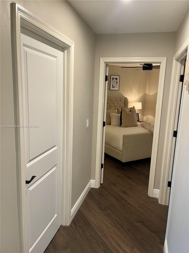 4370 NW 62nd Ter, Coral Springs, FL 33067 - hallway featuring dark wood-style floors and baseboards