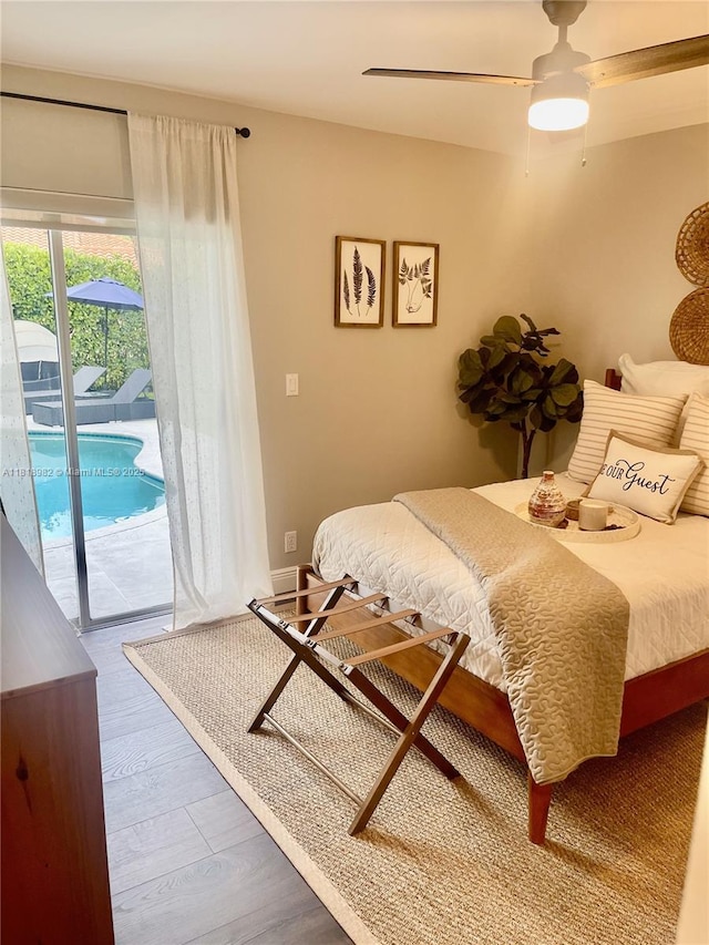 4370 NW 62nd Ter, Coral Springs, FL 33067 - bedroom featuring access to exterior, a ceiling fan, and wood finished floors