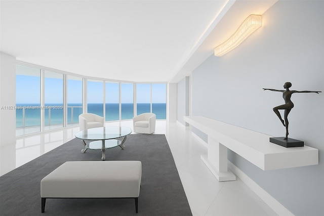 2711 S Ocean Dr Unit 1202, Hollywood, FL 33019 - living area featuring a water view, tile patterned floors, healthy amount of natural light, and carpet