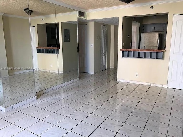 546 SW 1st St Unit 501, Miami, FL 33130 - unfurnished room featuring crown molding, a textured ceiling, light tile patterned floors, and electric panel