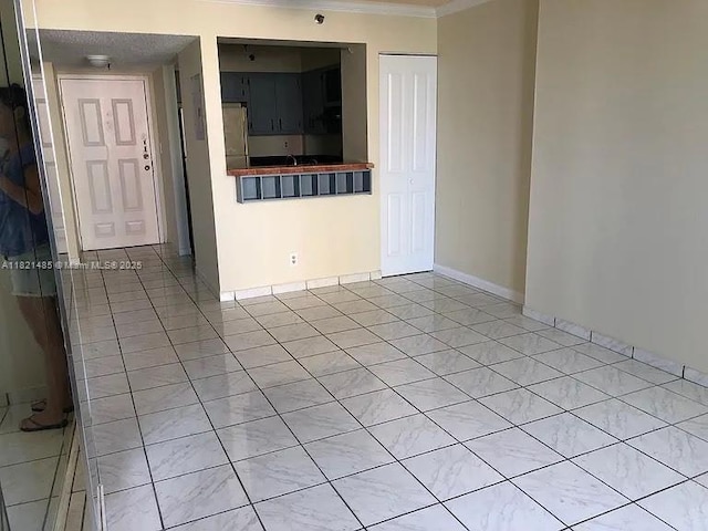 546 SW 1st St Unit 501, Miami, FL 33130 - spare room with light tile patterned flooring and ornamental molding