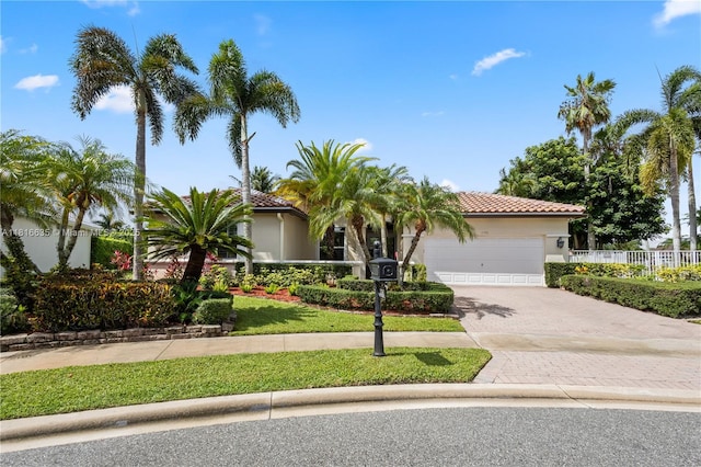11196 Sea Grass Cir, Boca Raton, FL 33498 - view of front of property with a garage, driveway, stucco siding, and a tile roof